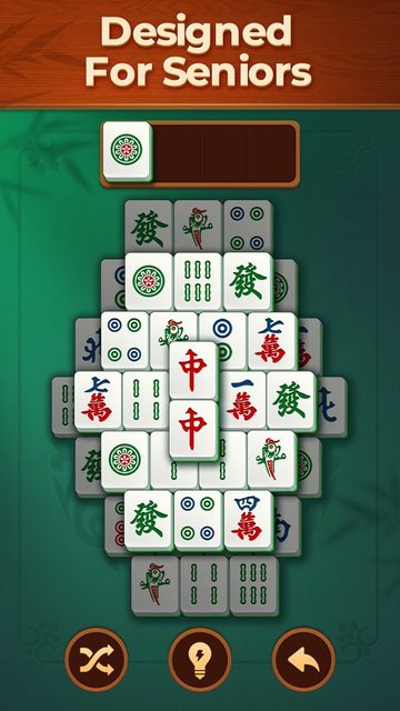 Vita Mahjong on iPhone showing a layered mahjong solitaire board under the caption Designed For Seniors